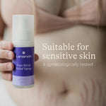 Lansinoh Post-Birth Relief Spray held during post-birth recovery
