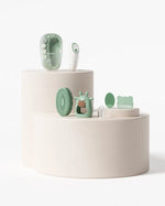Momcozy All-in-1 Glow Baby Kit with six essentials and retail box