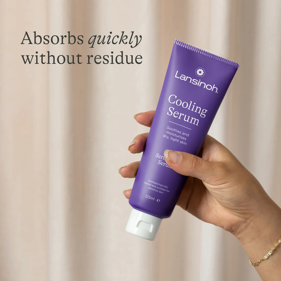 Applying Lansinoh Cooling Serum to pregnancy bump