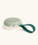 Close-up of Drift Away white noise machine power button and strap