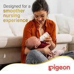 Mother feeding baby with Pigeon SofTouch 160 ml bottle